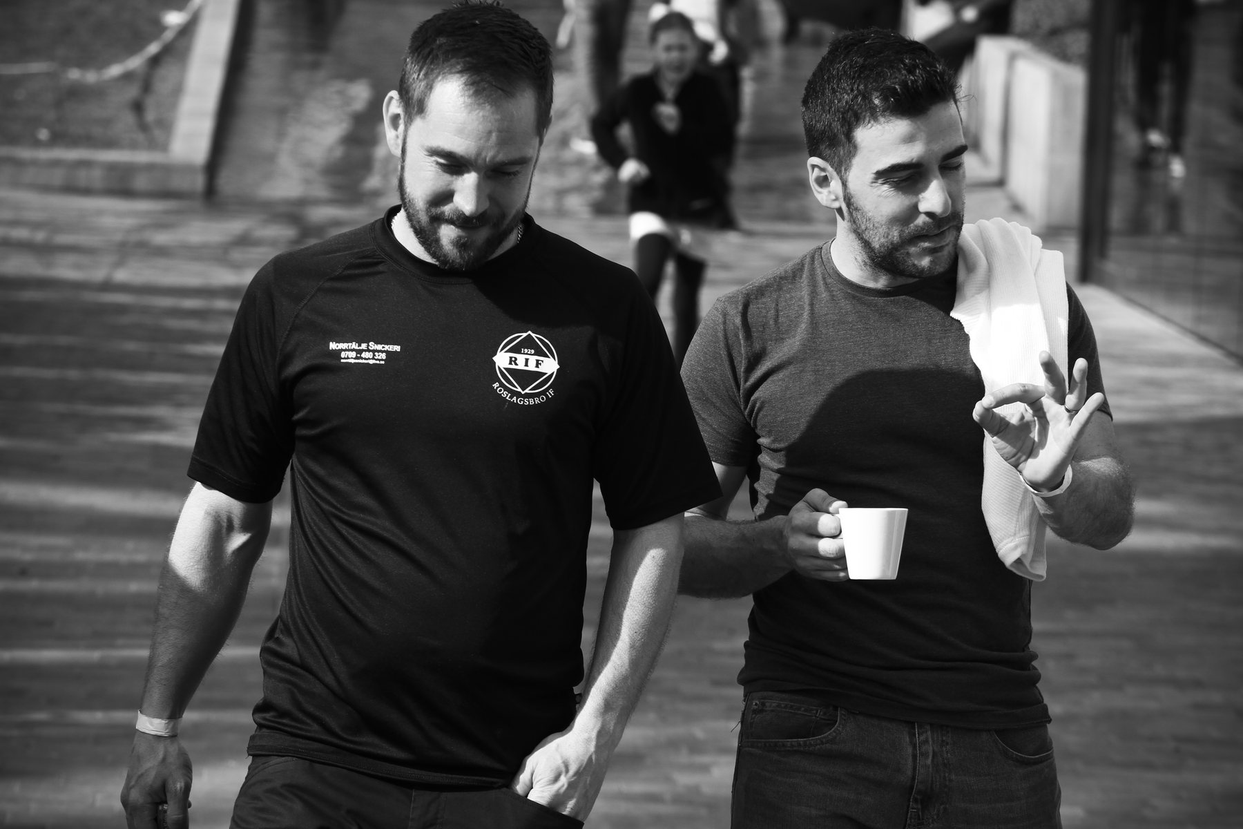 Football professionals discussing a training environment