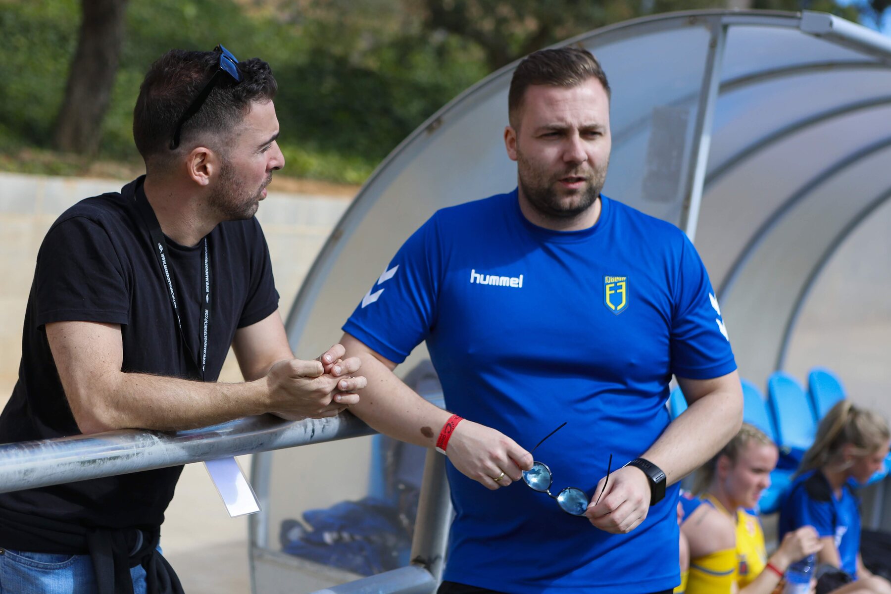 Football staff coordinating at a tournament