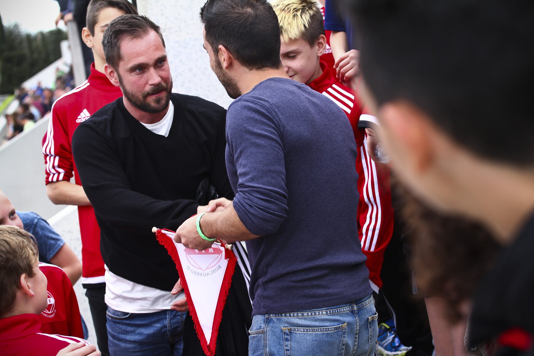 A team and football staff meeting at a tournament